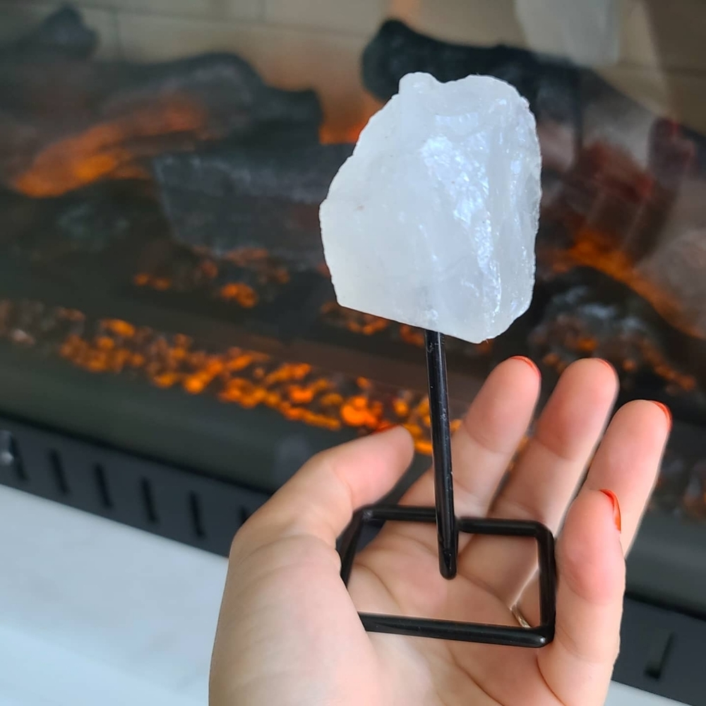 Raw Clear Quartz Crystal on a stand